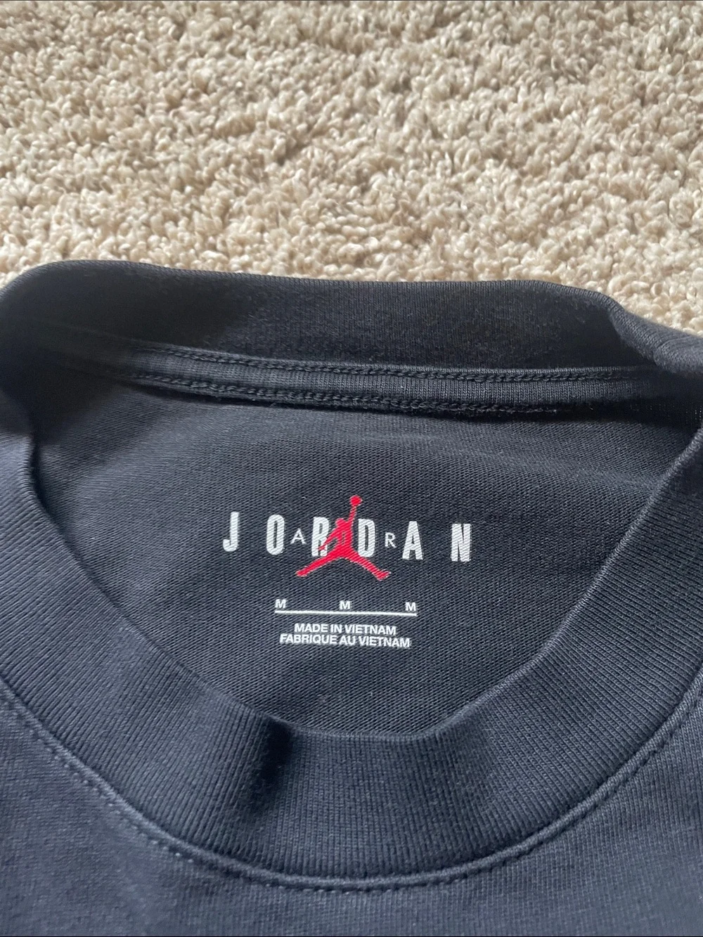 Jordan Long Sleeve Pocket Tee in Black with White Logo